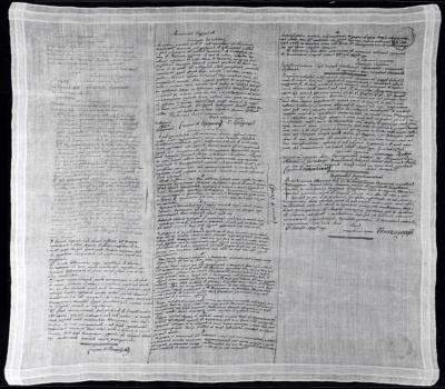 Платок А.Г. Муравьевой. Платок принадлежал жене декабриста Никиты Михайловича Муравьева, Александре Григорьевне Муравьевой, на который ею собственноручно были переписаны документы, связанные с ее переездом к мужу на каторгу в Сибирь. Хлопчатобумажная ткань, железо-галловые чернила.  ГА РФ. Ф. 1153. Д. 124.